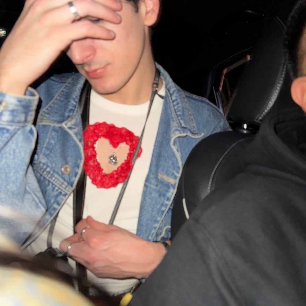 White shirt with red heart cutout, Sabrina Carpenter vibes